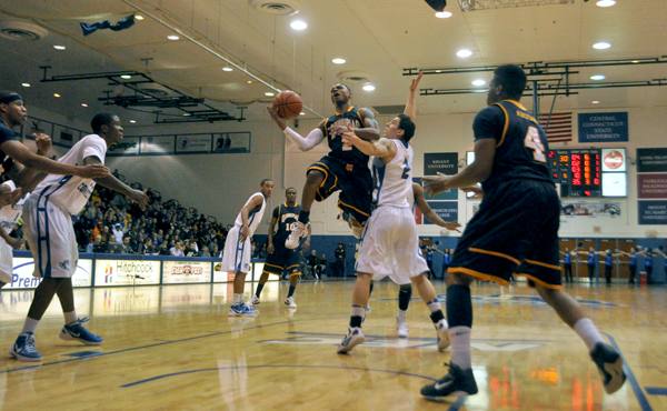 Quinnipiac 67, CCSU 59Quinnipiac's Dave Johnson finds a lane and goes for a layup in the first half of Sunday's game vs. CCSU.