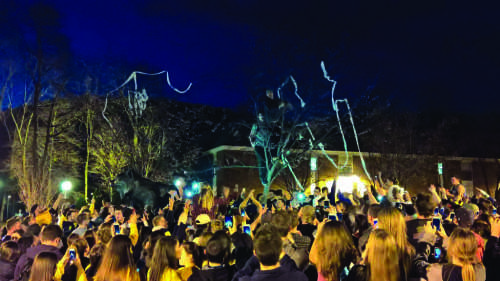 Students gathered around the Bobcat statue on the Mount Carmel campus after the men’s ice hockey team defeated Boston College in the Frozen Four semifinals on April 7.
