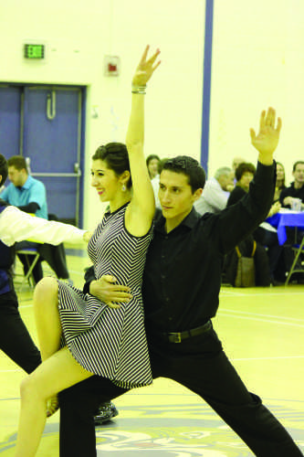 Senior Stephanie Azzarello and graduate student Alex Diaz dance during the annual Dancing with the QU Stars event.